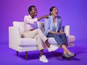 Image from Amazon Ads of two females on a couch watch TV